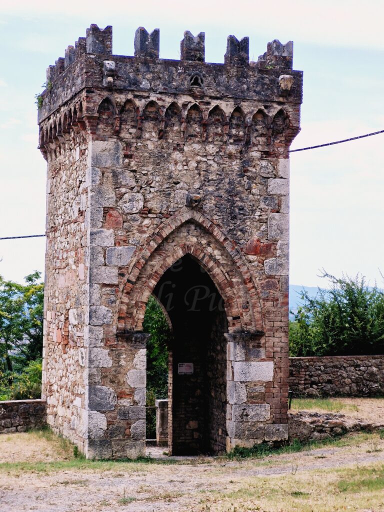 an old stone tower that looked defensive with a rather large gate