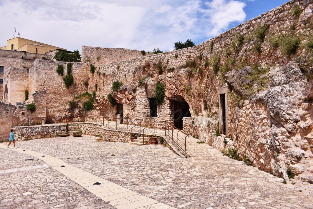 Pulsano Abbey - Low-rise building with multiple entrances and windows.