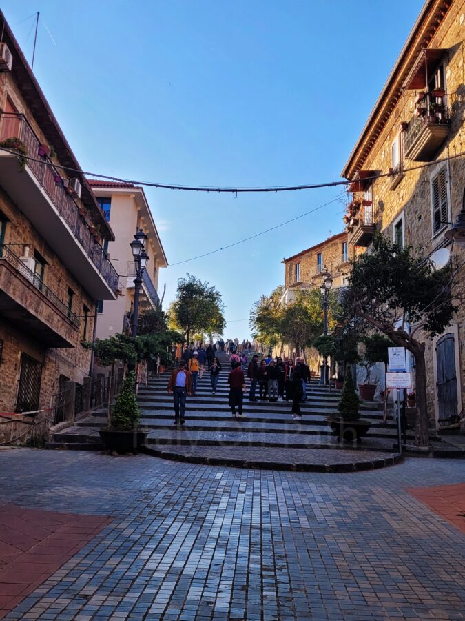 Stone staircase street with visitors leading up to the historic borgo in Agropoli, Campania
