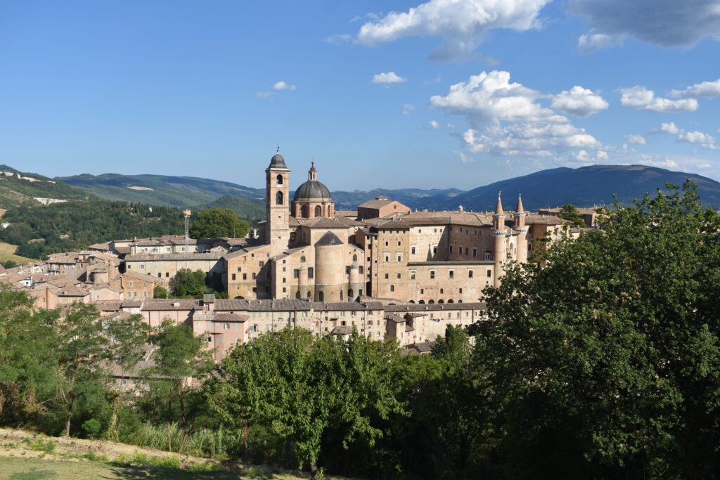 Panorama of Urbino in Marche with a palace complex built of gray bricks