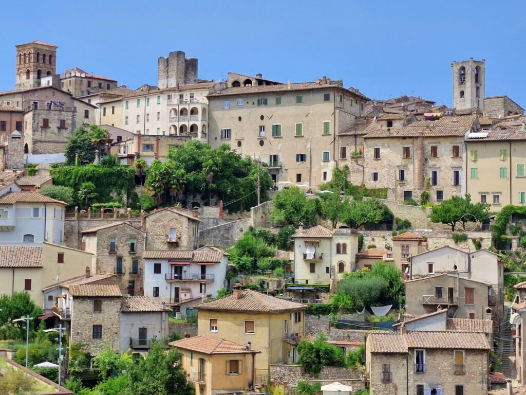Things to do in Narni. Panorama of stone medieval houses and bell towers built on a steep hillside in Narni, Umbria.