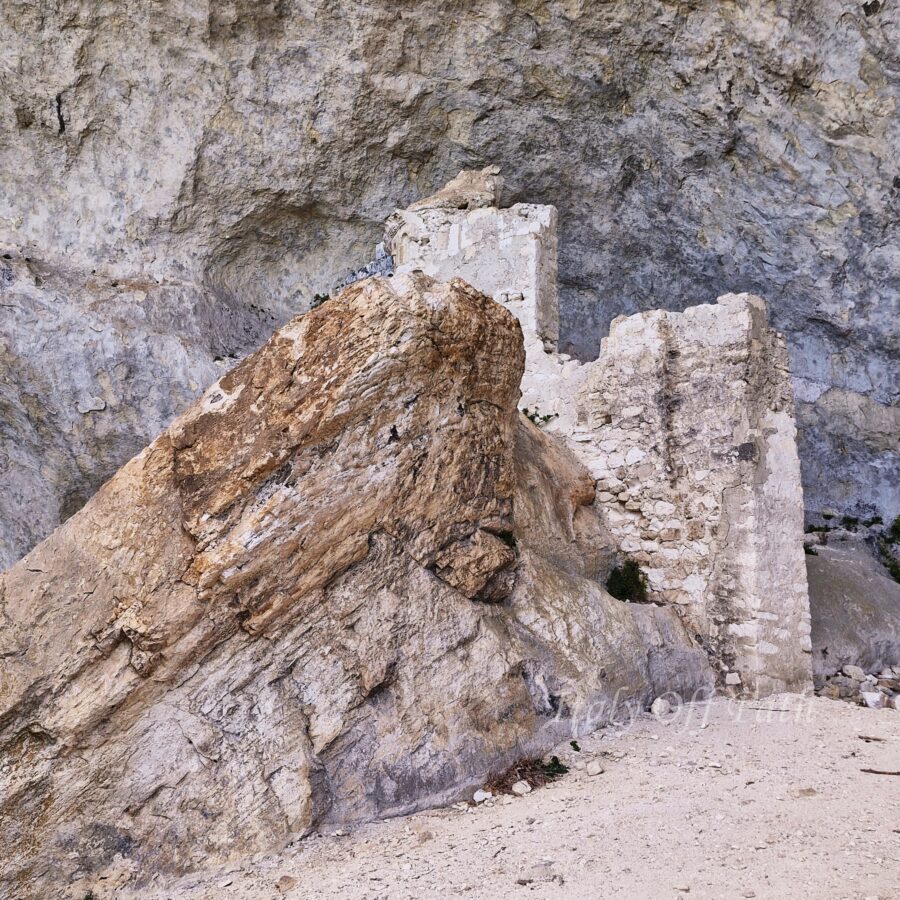 Ruins of the medieval hermitage of S. Angelo di Palombaro built into the rocky cliffside in Abruzzo, Italy.