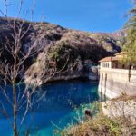 Lake San Domenico in Abruzzo with crystal-blue water, rocky gorge and hydroelectric dam during Off-Season Travel in Abruzzo Abruzja zimą