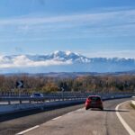 Road in Abruzzo with snow-covered Majella Mountains in the background