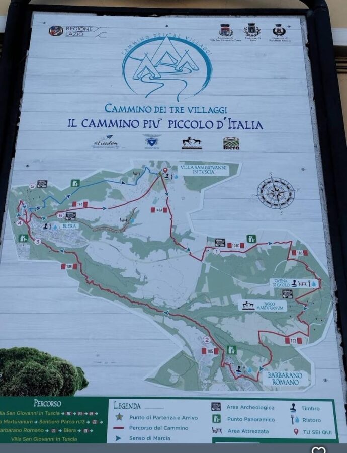 Hikes near Rome. An outdoor information board showing the official trail map of the Cammino dei Tre Villaggi loop in Lazio, Italy, displaying the route connecting Villa San Giovanni in Tuscia, Barbarano Romano, and Blera.