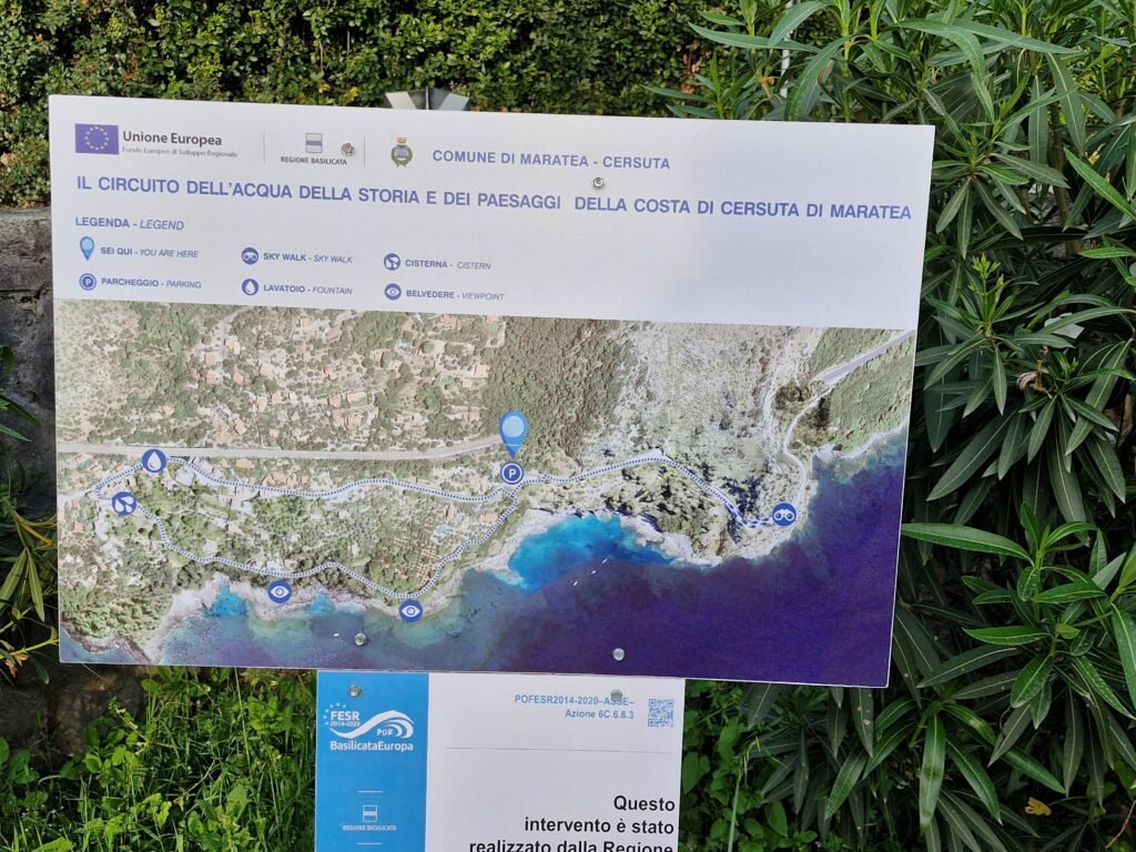 Information board with a map of the coastal walking path and skywalk in Cersuta di Maratea, Basilicata.