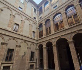 Inner Renaissance courtyard and brick archways of Palazzo Spada in Terni Umbria