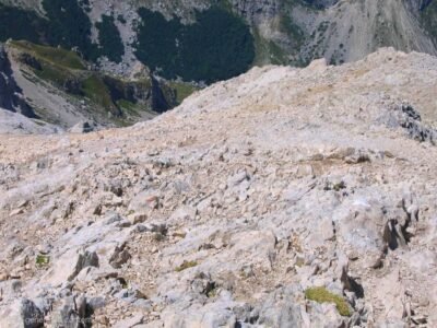 Steep and exposed limestone scree slope on the final stretch of the trail leading to the summit of Corno Grande, Gran Sasso, Abruzzo, Italy.