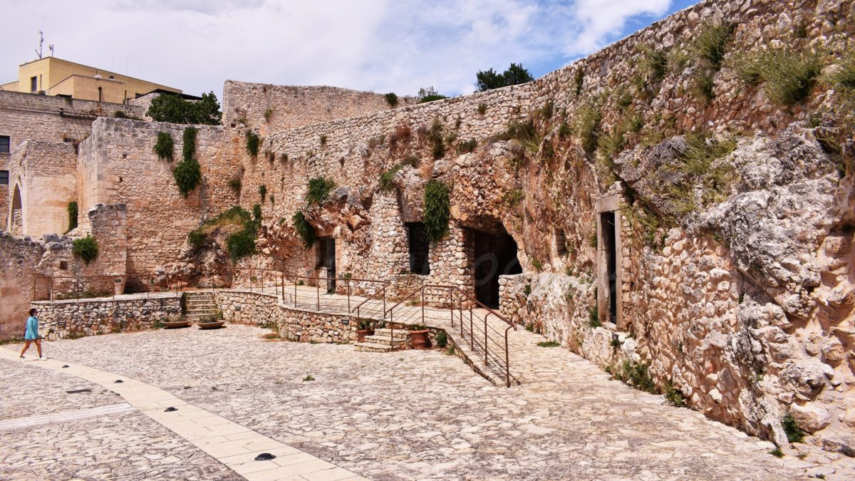 Pulsano Abbey - Low-rise building with multiple entrances and windows.