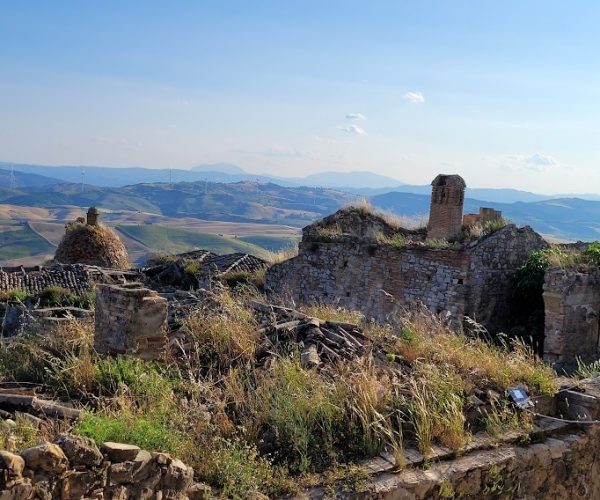 runis-of-the-houses-panoraic-view-os-low-mounains-in-the-background in Craco