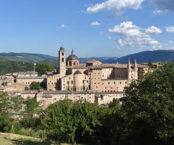 Panorama of Urbino in Marche with a palace complex built of gray bricks